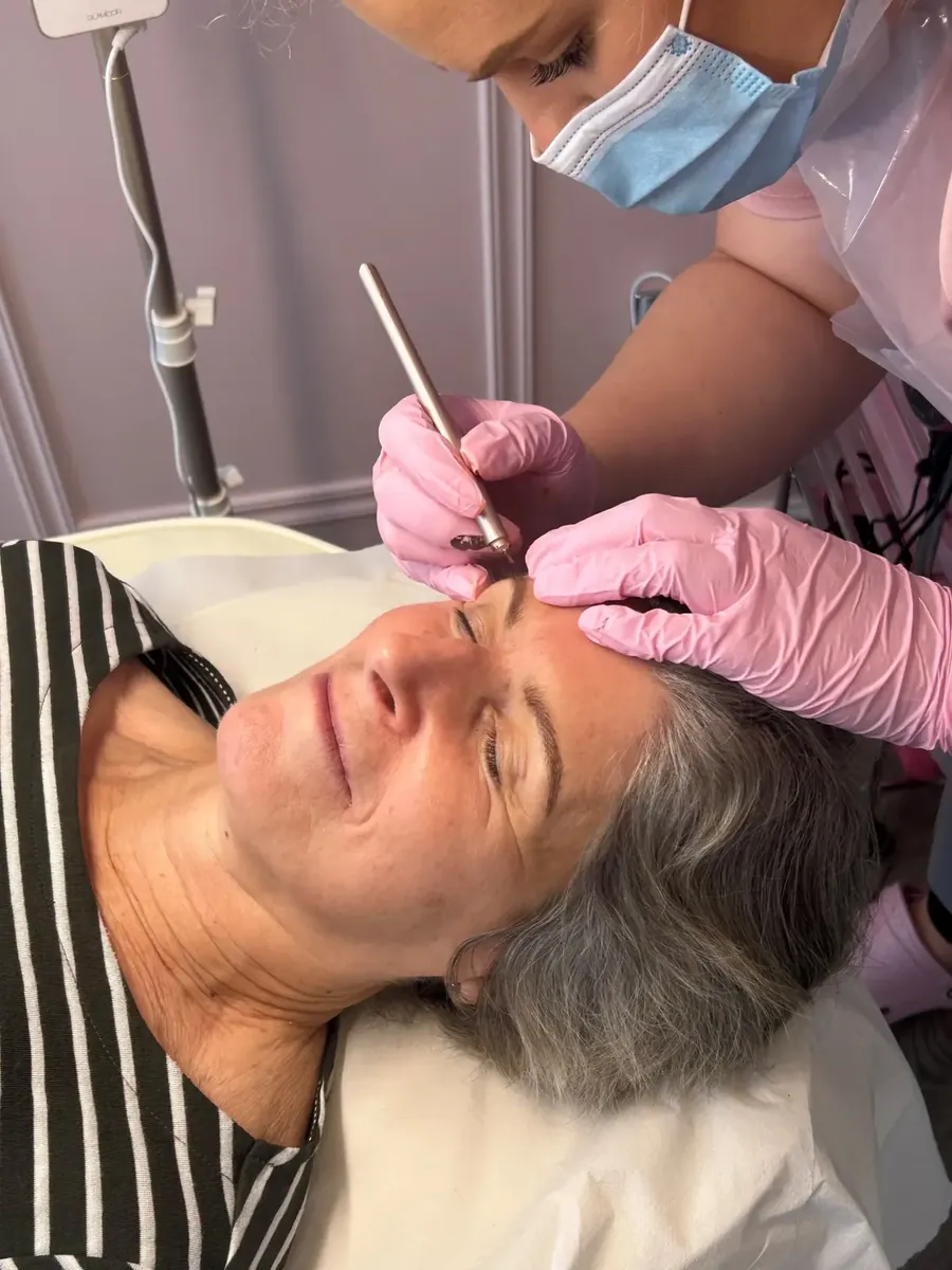 Lucy microblading a client's brows at her Shavington studio, Cheshire